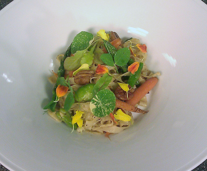 Fresh fettucini with local young vegetables, nasturtium leaves and pecans.
