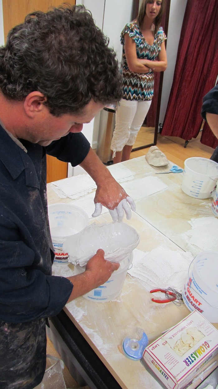 Jeff fills the negative/mold with plaster