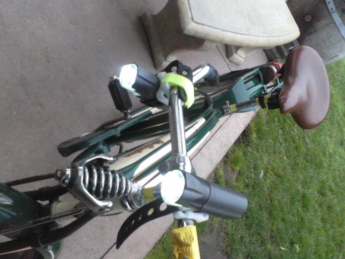 Two of my six working prototypes, demonstrating rotating handlebar mount, on my Dad's 1946 Schwinn.