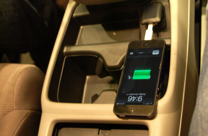 The Nomad charging from a USB port in a vehicle