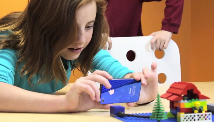 The flash on Fiona's phone triggers the exploding ATOM to bust apart the LEGO house. Yep, prank your sister!