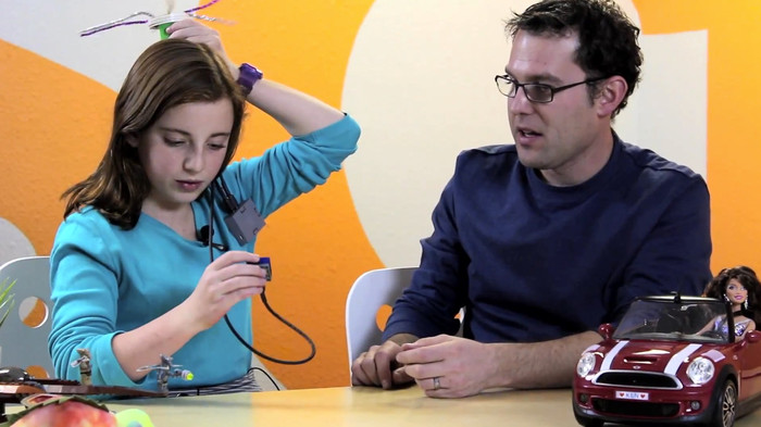 Fiona and Michael work on an ATOMS creation.