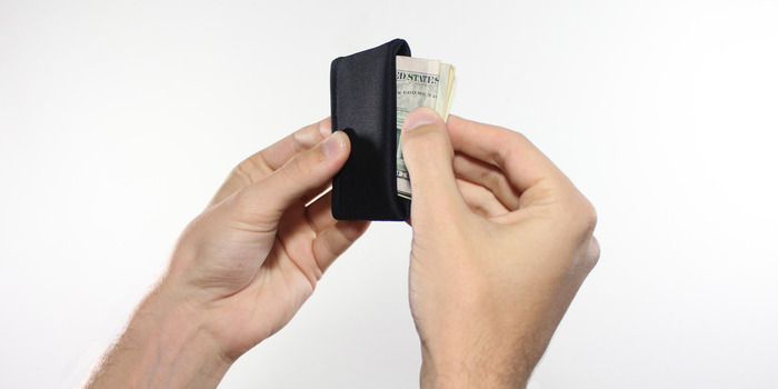 Cash can be placed in the third, bottom compartment.