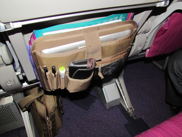 A latter prototype on a long haul flight to Asia. It's just soooooo much easier to have all the stuff you need right there without having to go digging for any it.
