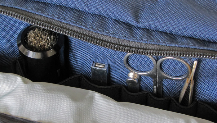 Milspec webbing is used to keep grooming essentials organized in the side pocket.