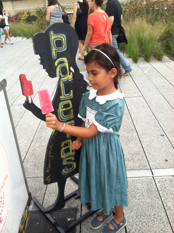 Little girl trying to mimic sillhouette of our flavor board with a (naturally) pink limeade