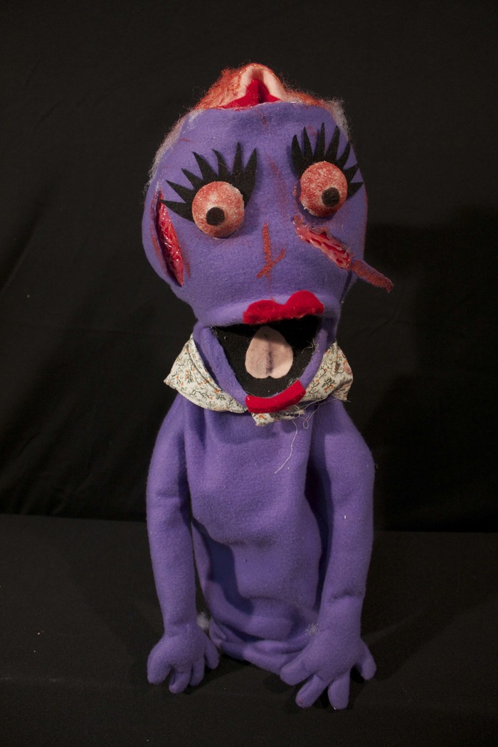 Fliptop - She was just a nice lady trying to find out what happened to the power. After she had a rendevous with the zombie Handlebars in the elevator, her flopping scalp became her new identity and she joined the other undead terrorizing the building.
