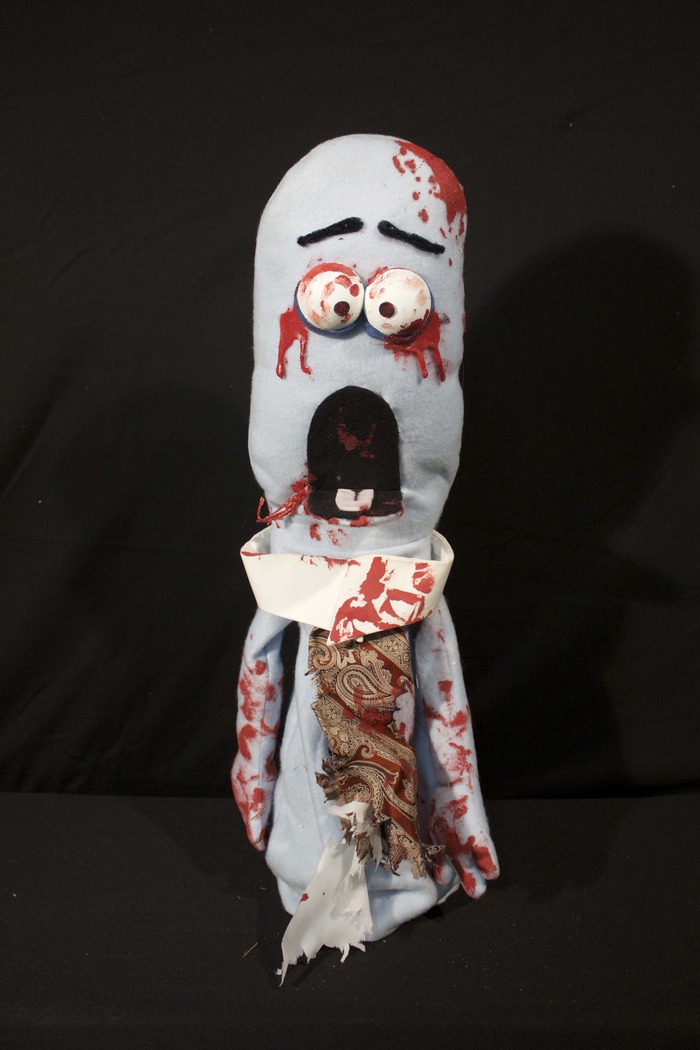 Boo - Boo was a business man on his way home from work when he was turned into one of the undead. Not really knowing what to do, he milled outside the apartment building until another zombie let him and the rest inside.
