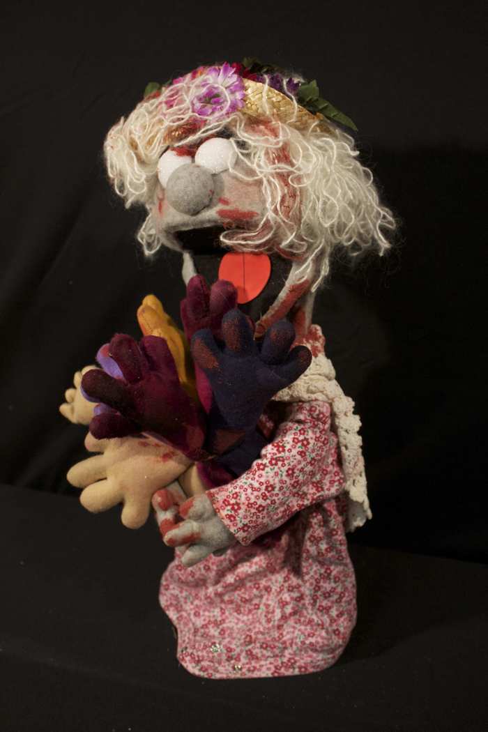 Flower Girl (with bouquet of arms) - The Flower Girl was caught in the hall way and killed shortly after Pinky. Once zombified she thought that hands rather looked like flowers.