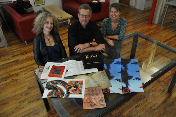 Seeking Kali Artist Collective signing their limited edition in the offices of Hyperallergic, Brooklyn, NY. Photo courtesy of Hrag Vartanian.