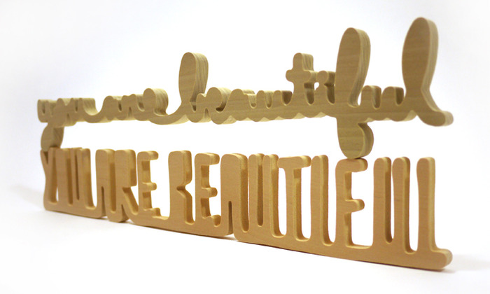 Samples of hand cut wood edition (3" x 18") rewards - Cursive (top), All Caps (bottom).