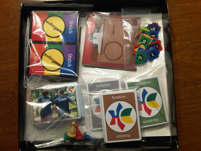 Here it is in the box! There are plenty of baggies included so that you can keep your cards safe, even at camp! The double-sided Scoreboard goes on top.