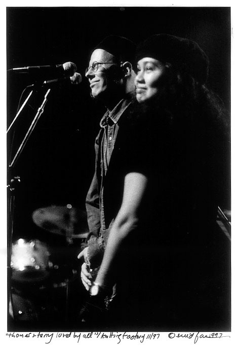 Photographer Enid Farber captured this poignant moment in 1997 at the Knitting Factory, on stage, of Thomas and Terri at a benefit concert held for him and attended by friends and fans.