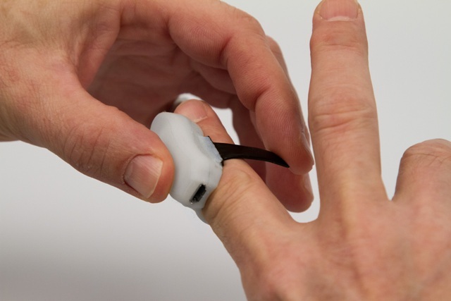 Begin wraping the semi-rigid strap around your finger