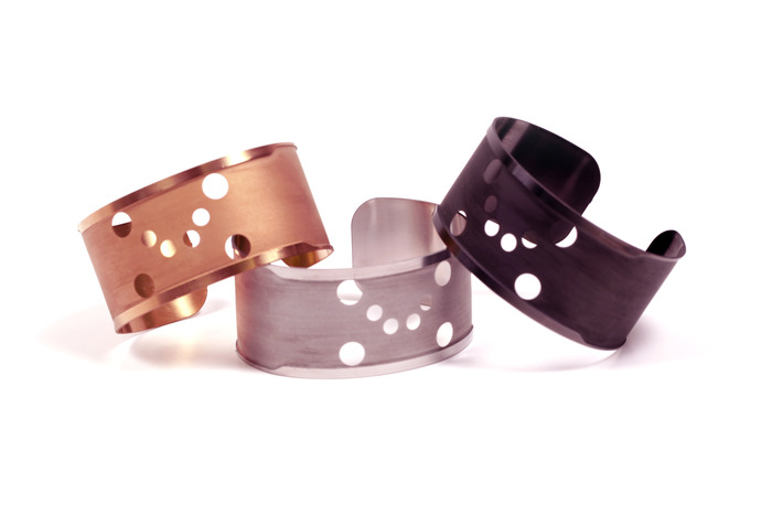 The three colors of bands before laminating the electronics and mask.