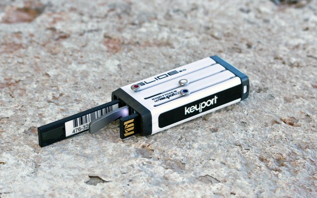 Available inserts include a flash drive, mini-light, bottle opener, and barcode holder.