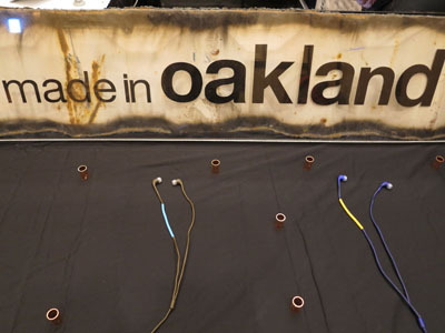 Prototypes for upcoming earbud models at CES 2013 -- the copper fittings are not a part of the product, just for booth style