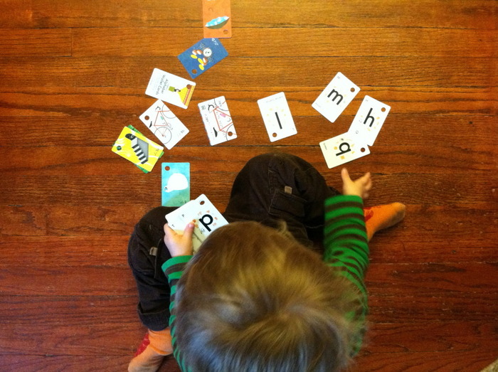 Silas playing with the Alphabet deck.