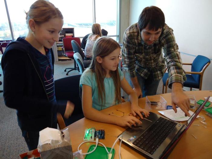 The team developing software. Stephen -- ThoughtSTEM Co-Founder -- helps them make good design decisions.