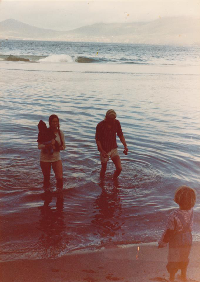 The whole family walking in a rare lagoon on An Tráigh Bhán, The White Strand.
