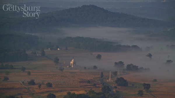 The Gettysburg Battlefield: Cemetery Ridge with the Round Tops beyond.