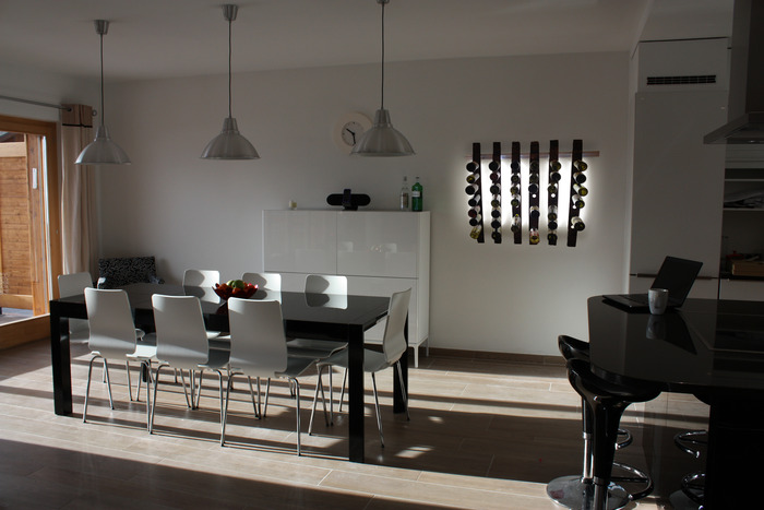 LUMI Wine Wall in a dining room setting.