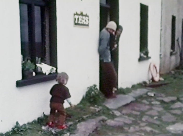 Daniel, Roger and Lesley Hambrook outside their cafe and hostel on the uninhabited Great Blasket Island, 1977.