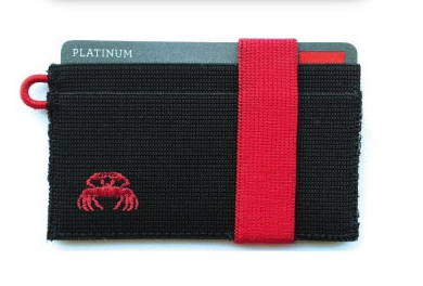 I didn't have the equipment to put the crab on the wallet, so I started making connections with some manufacturers to see how it could be done. This is the prototype they sent back with a crab embroidered on it.
