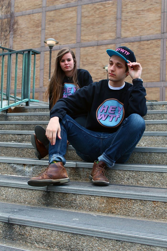 The Black HEY WTF Crewneck ($35) and Snapback ($30)