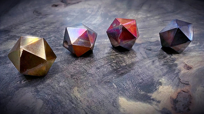 Note: Very early prototype d20s repurposed for use in flame polishing study. Final dice will be of much higher quality.