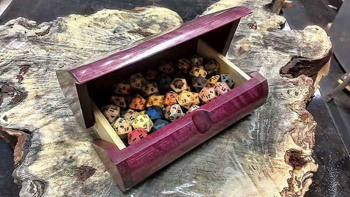 Assorted Dryad d20's in a custom "The Luggage" Dice Box by Ray Jones.