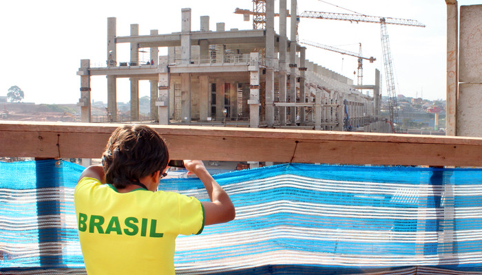 Teenager looking at Sao Paulo's newest stadium, Brazil