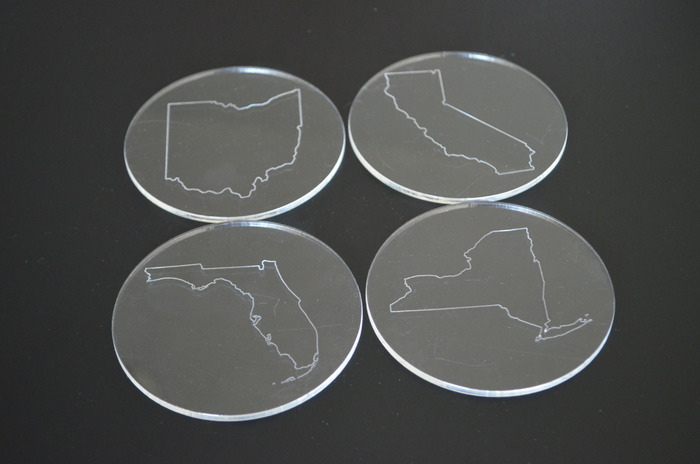 Pick your state out line to be etched on four coasters, laser cut from reclaimed acrylic.