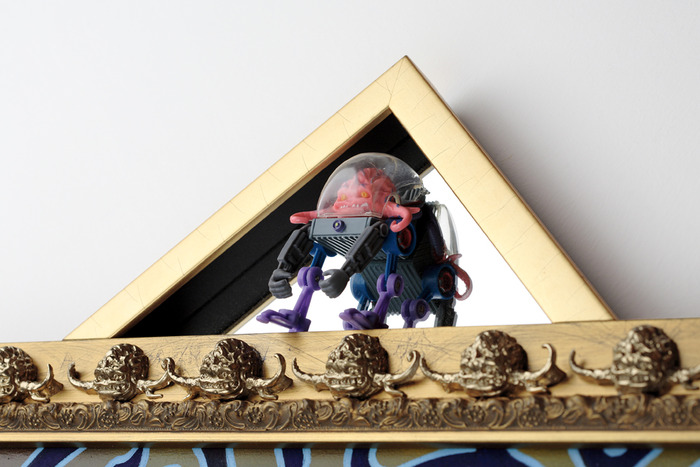 "Playmates' Krang" (detail of frame, toy, and custom moulding)