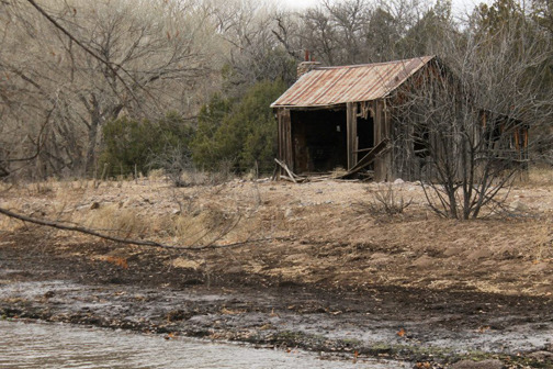 A dilapidated house on the property