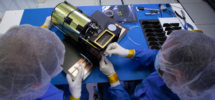 Engineers at Planetary Resources assembling the ARKYD prototype spacecraft.