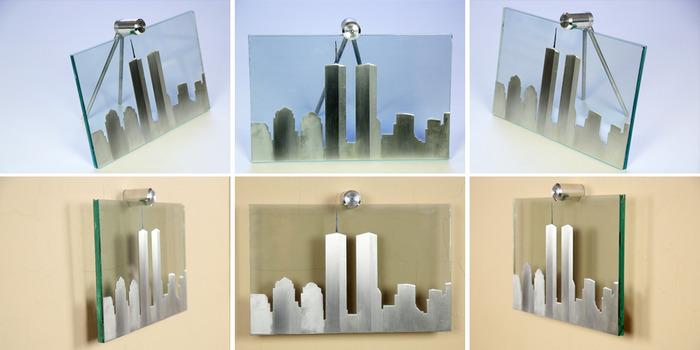 Size: 11" x 7" x 2". The skyline is cut out of aluminum material with a line-grain sanding process to add characteristics to each building. The antenna on top is sandblasted on the front of the glass and painted black.