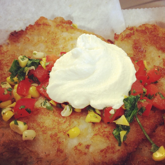 Funnomenom's potato pancakes (gluten free and vegan friendly) topped with homemade vegan sour cream and roasted corn salsa