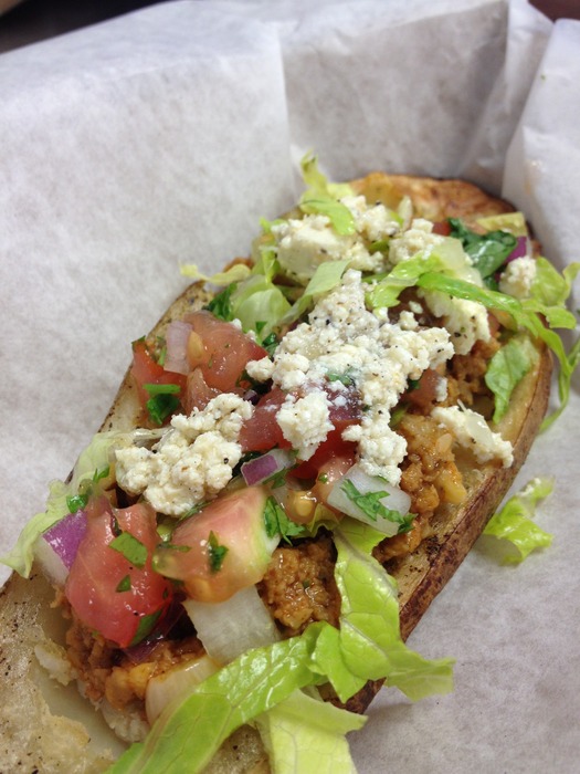 Funnomenom's Paco...A vegan friendly potato skin taco. Ground seitan, pico de gallo, romaine and home made vegan queso fresco