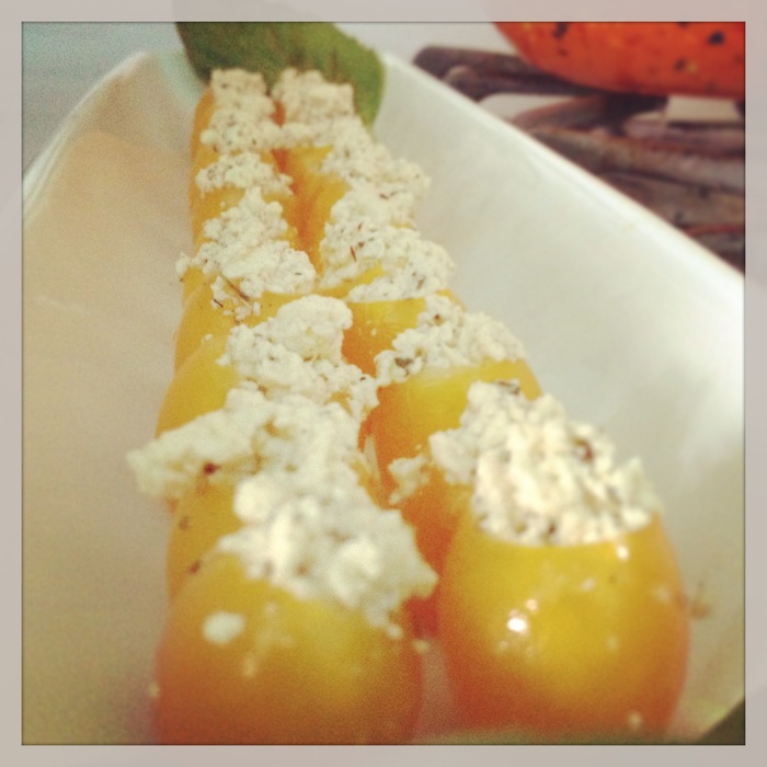Grape tomatoes stuffed with homemade vegan feta.