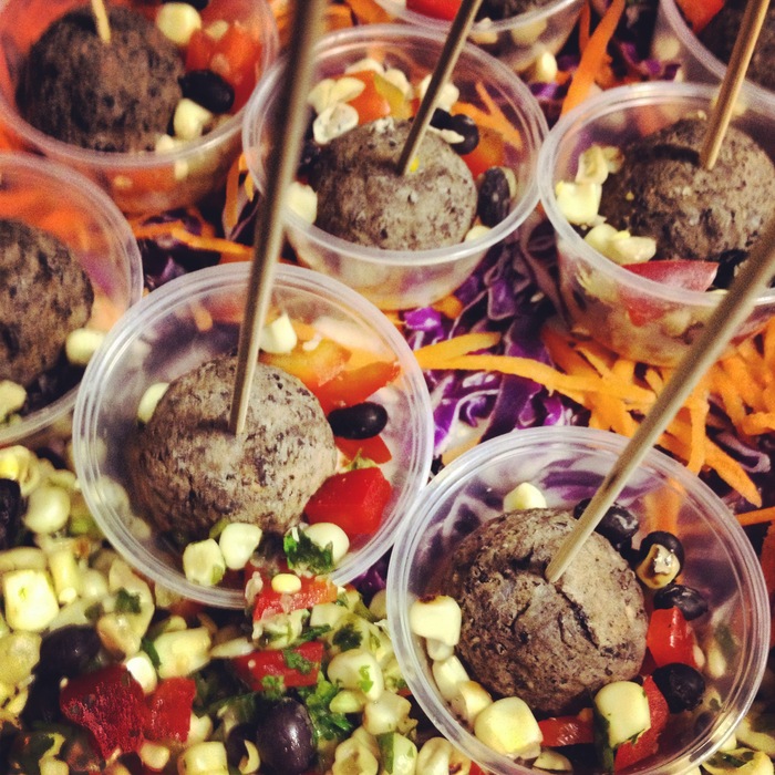 Black bean lollipops (gluten free and vegan friendly) in a sun dried tomato jalapeno cream sauce.