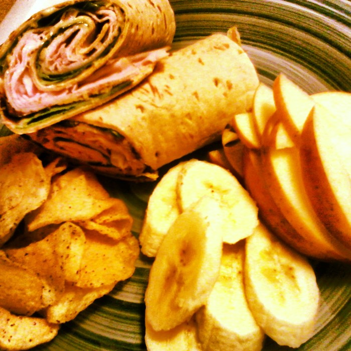 Herbed Turkey, Poppy Seed Dressing, Arugula in a Herbed Flat bread served with fresh apples, banana's and house made chips