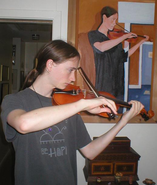 Gabriel on violin next to a painting I did of him as a child.