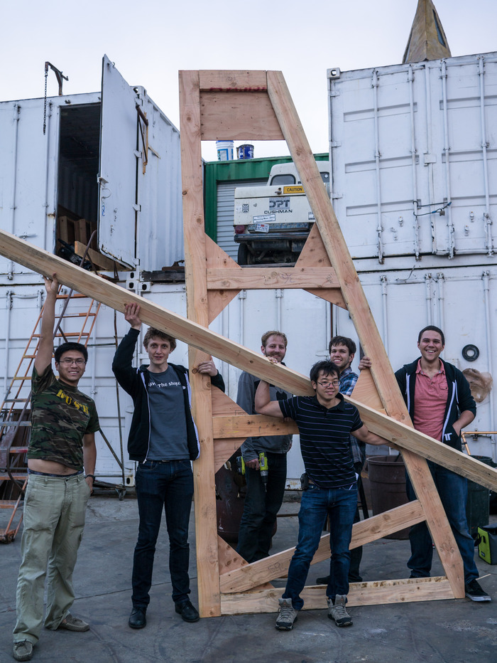 About few members of the group, working on structural supports.