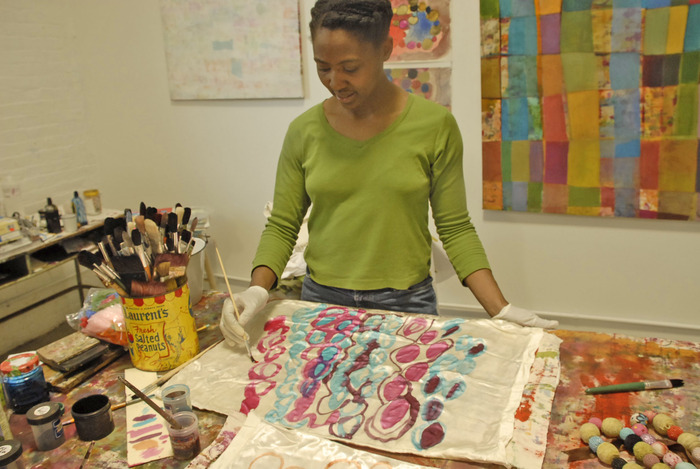In Studio: Handpainting on silk. Many of my designs are hand drawn.
