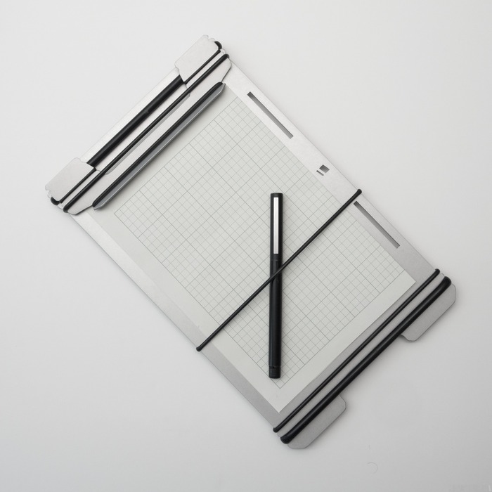 SMALL BANDBOARD WITH PEN AND FOLDED PAPER