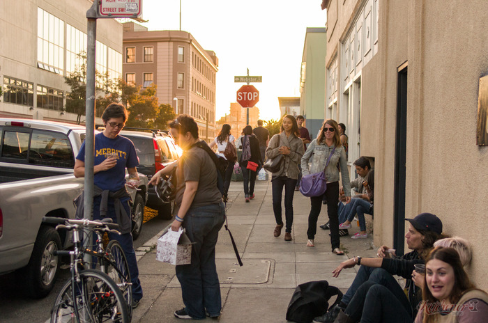 A lot of happy eaters finding a place to sit on 24th Street during one of our food events