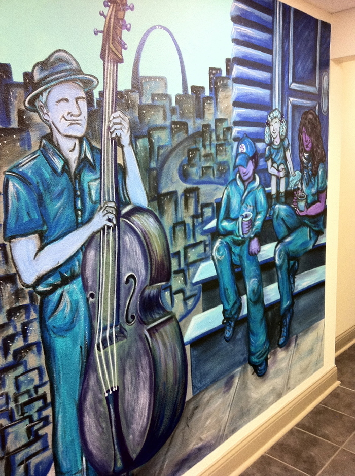 A mural that Chelsea designed with residents of a low-income housing community, for their lobby.