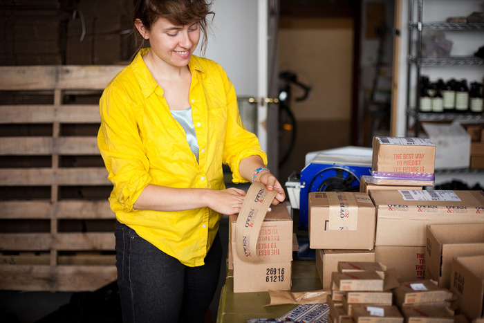 Alyssa shipping orders in the office