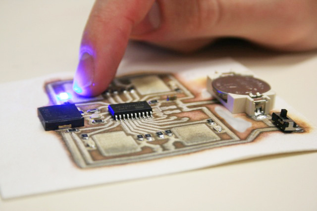Touch sensitive "Simon Says" game printed on paper